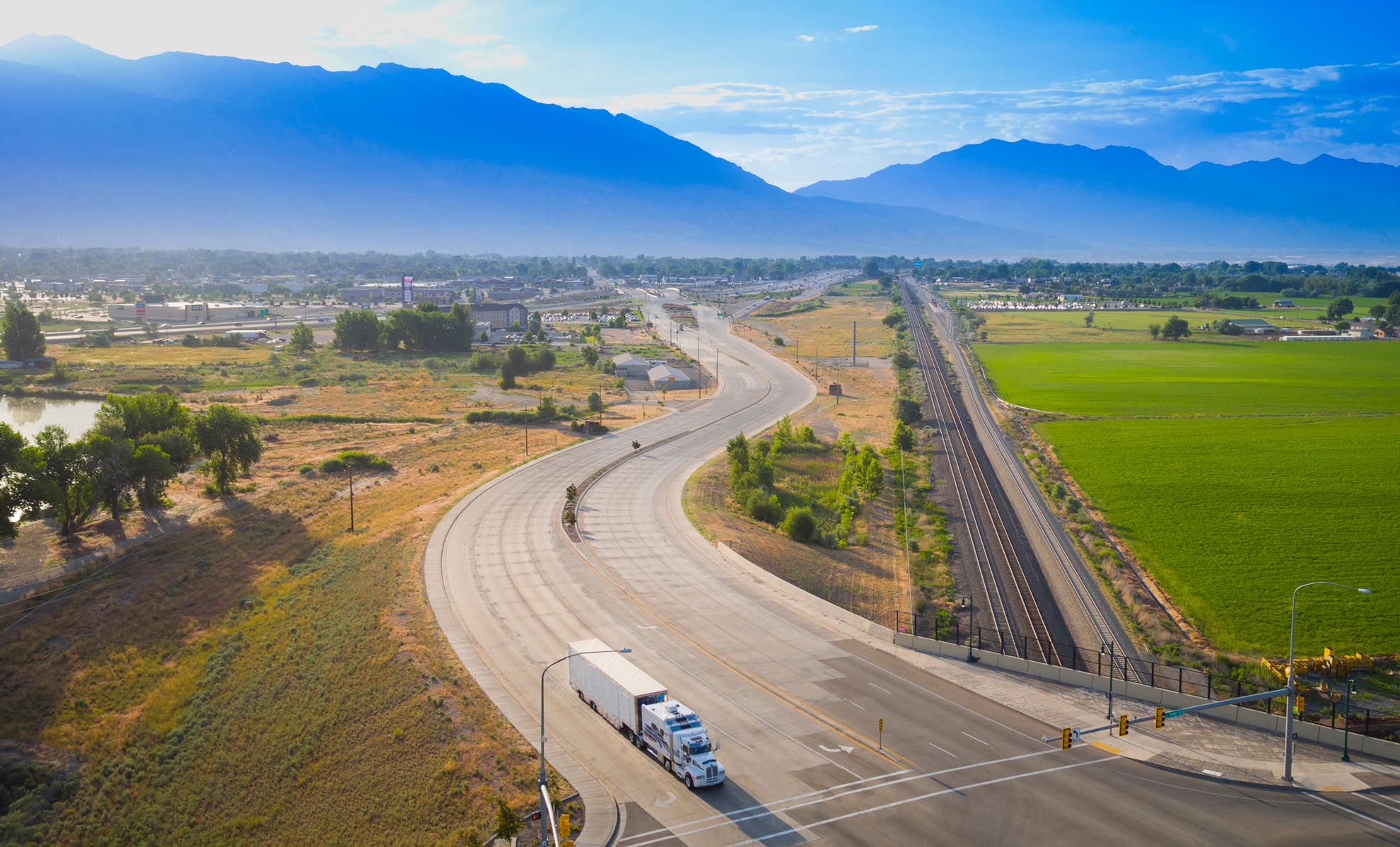 Drone Photograph of Moving truck in the morning with Wasatch Mountains in the background