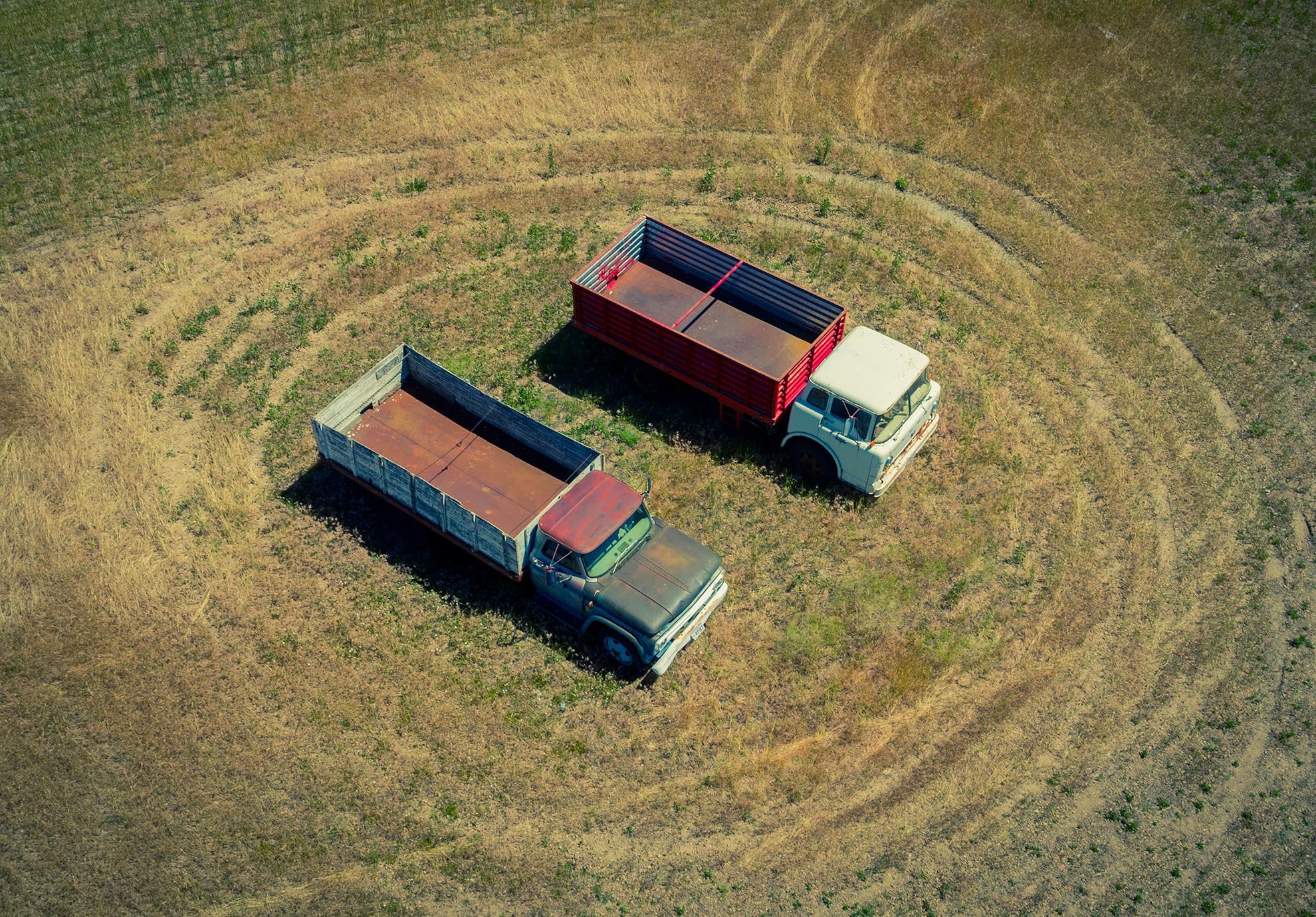 Drone Photograph of Farm Trucks in Utah Field