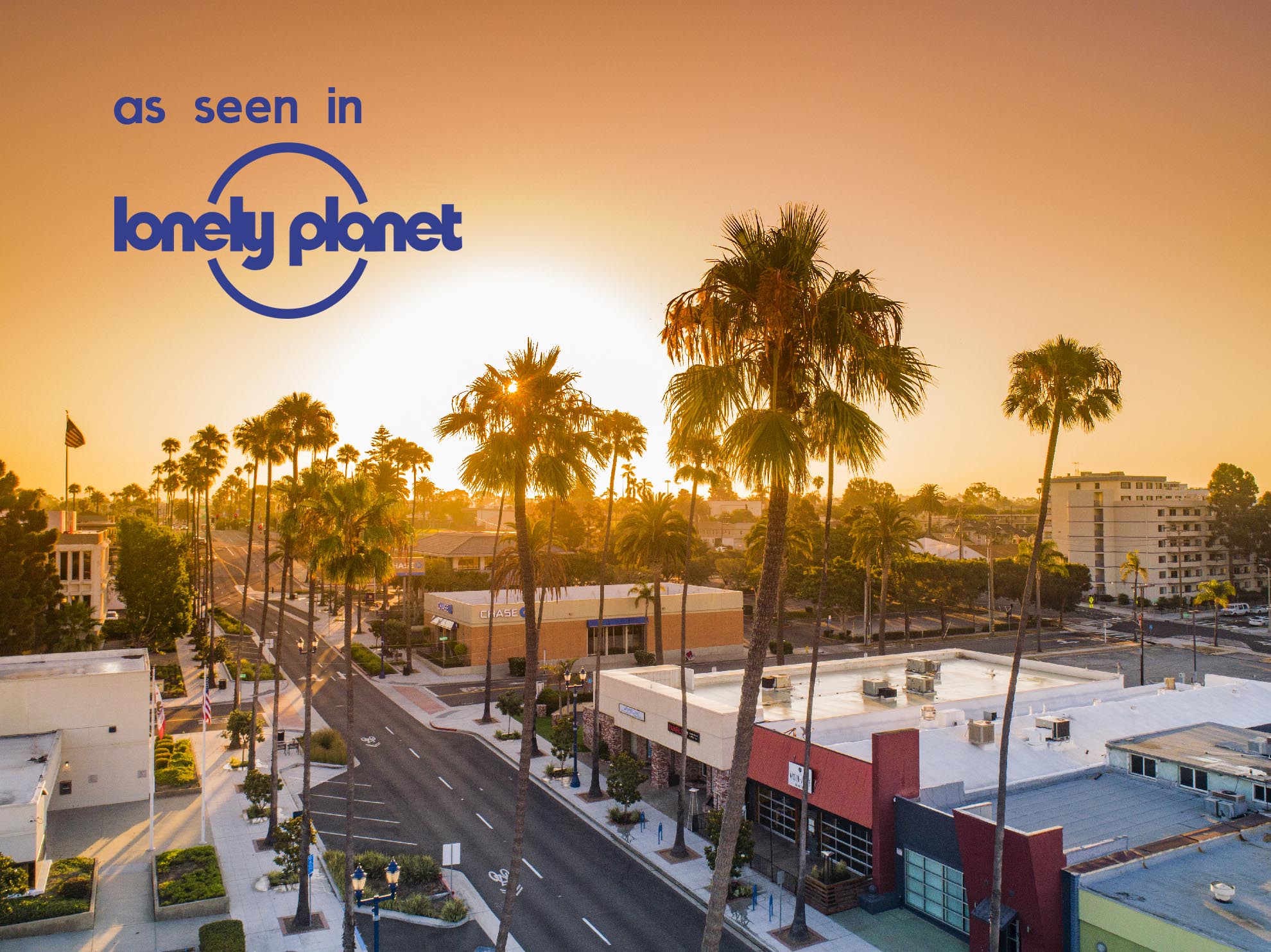 Drone photograph of Oceanside Center at Sunrise with Lonely Planet Logo