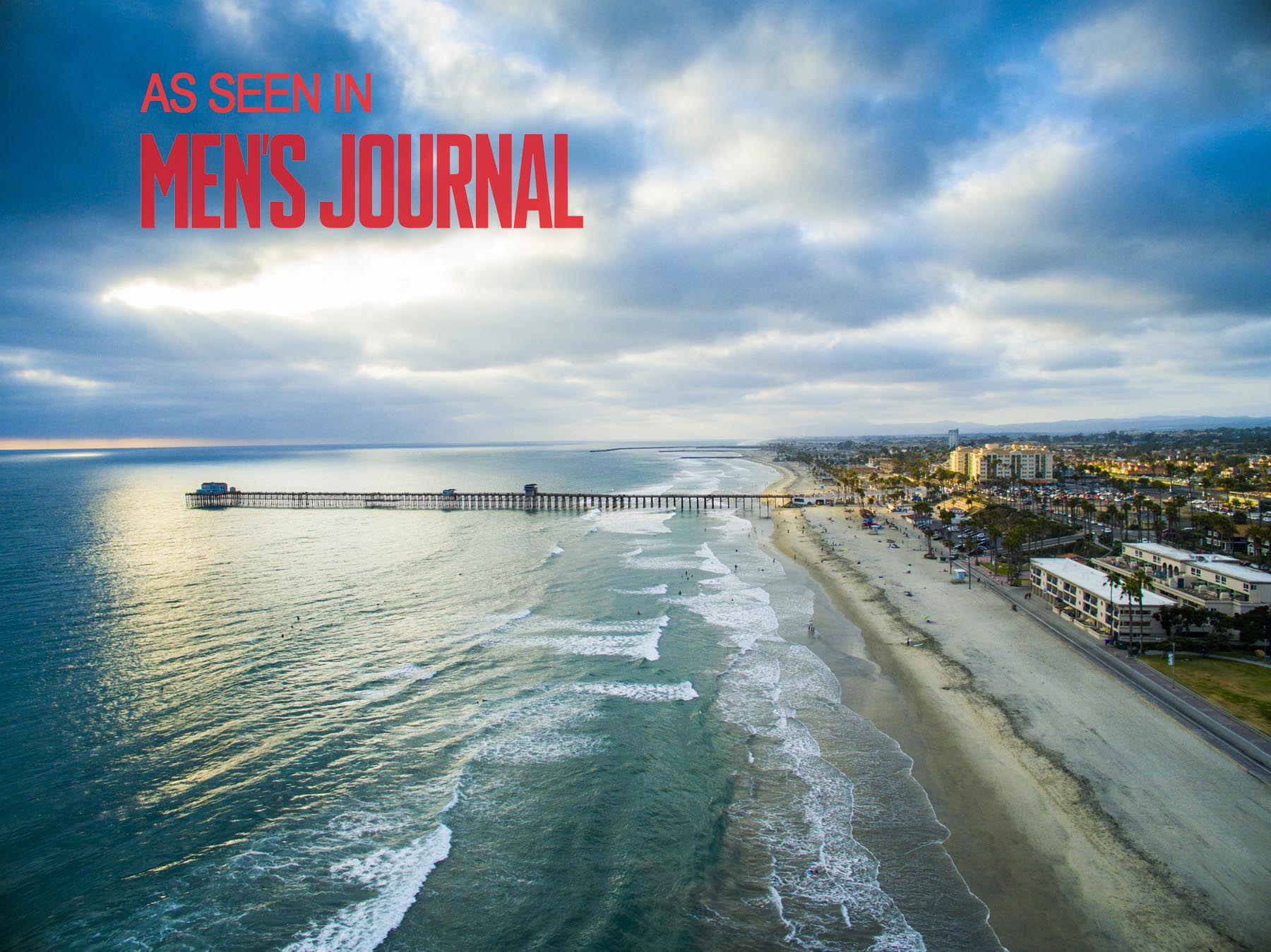 Drone Photograph of Oceanside Pier at Sunset with Mens Journal Logo
