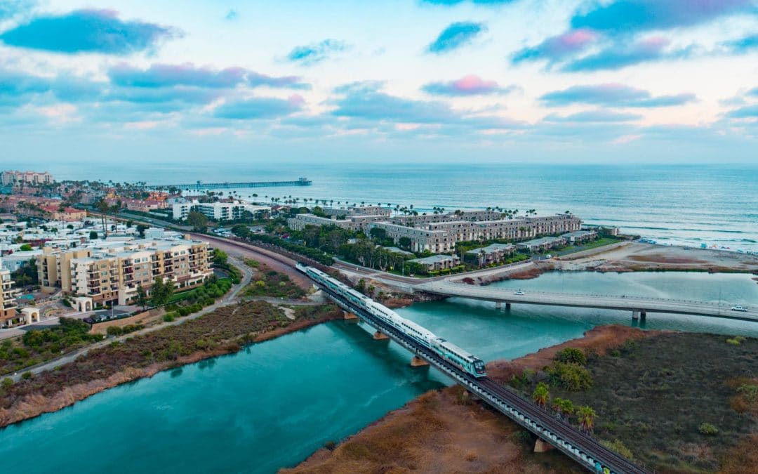 Photograph of Metrolink train going through Oceanside California at sunset taken with a drone