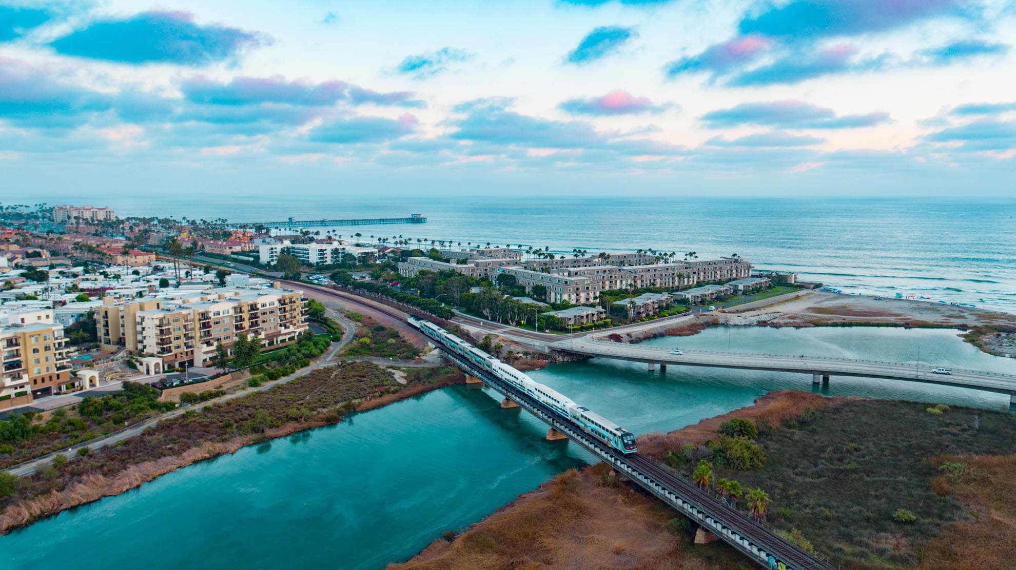 Photograph of Metrolink train going through Oceanside California at sunset taken with a drone