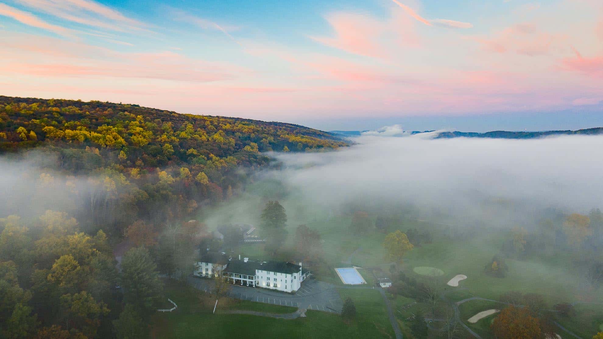 Drone photgraph of morning fog over Water Gap Country Club in Autumn