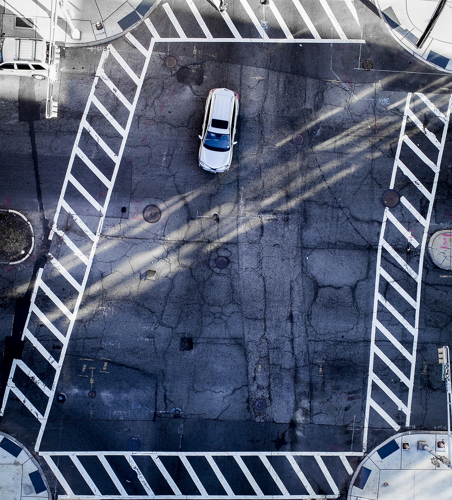 Drone Photograph taken of a car in an intersection in Newark New Jersey