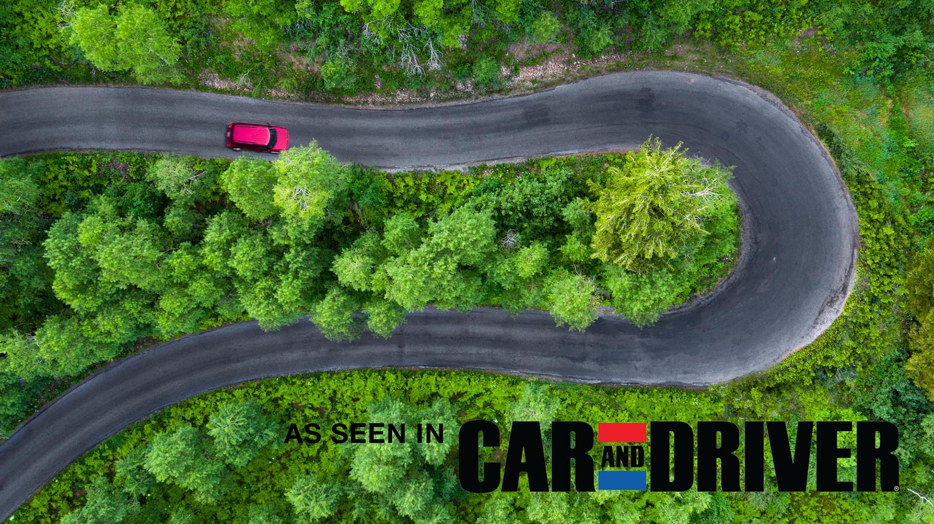 Drone Photograph of a red car on a Horse shoe road in UTAH