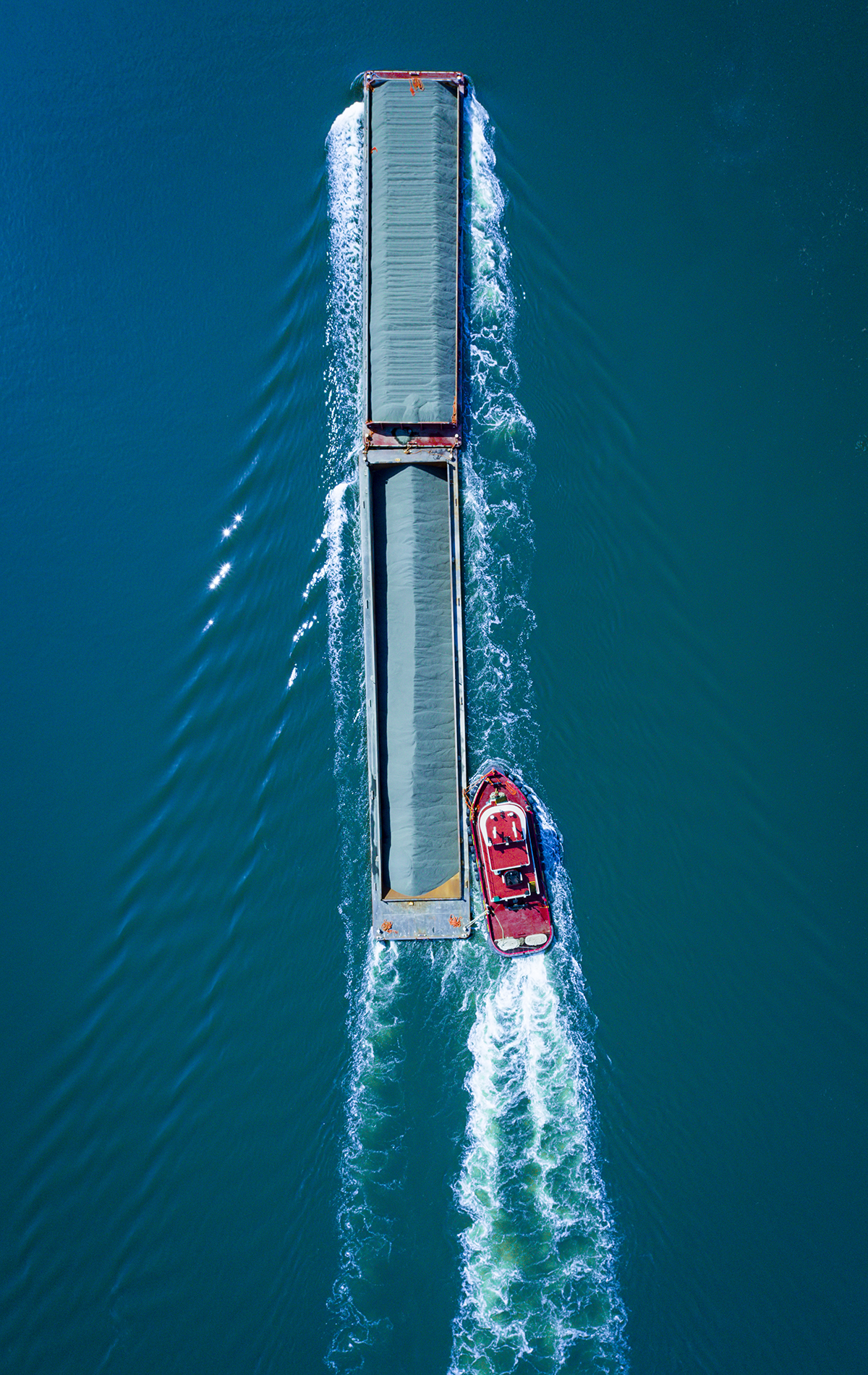 Drone Photograph Nadir angle of a barge going up the Arthur Kill Waterway in New Jersey