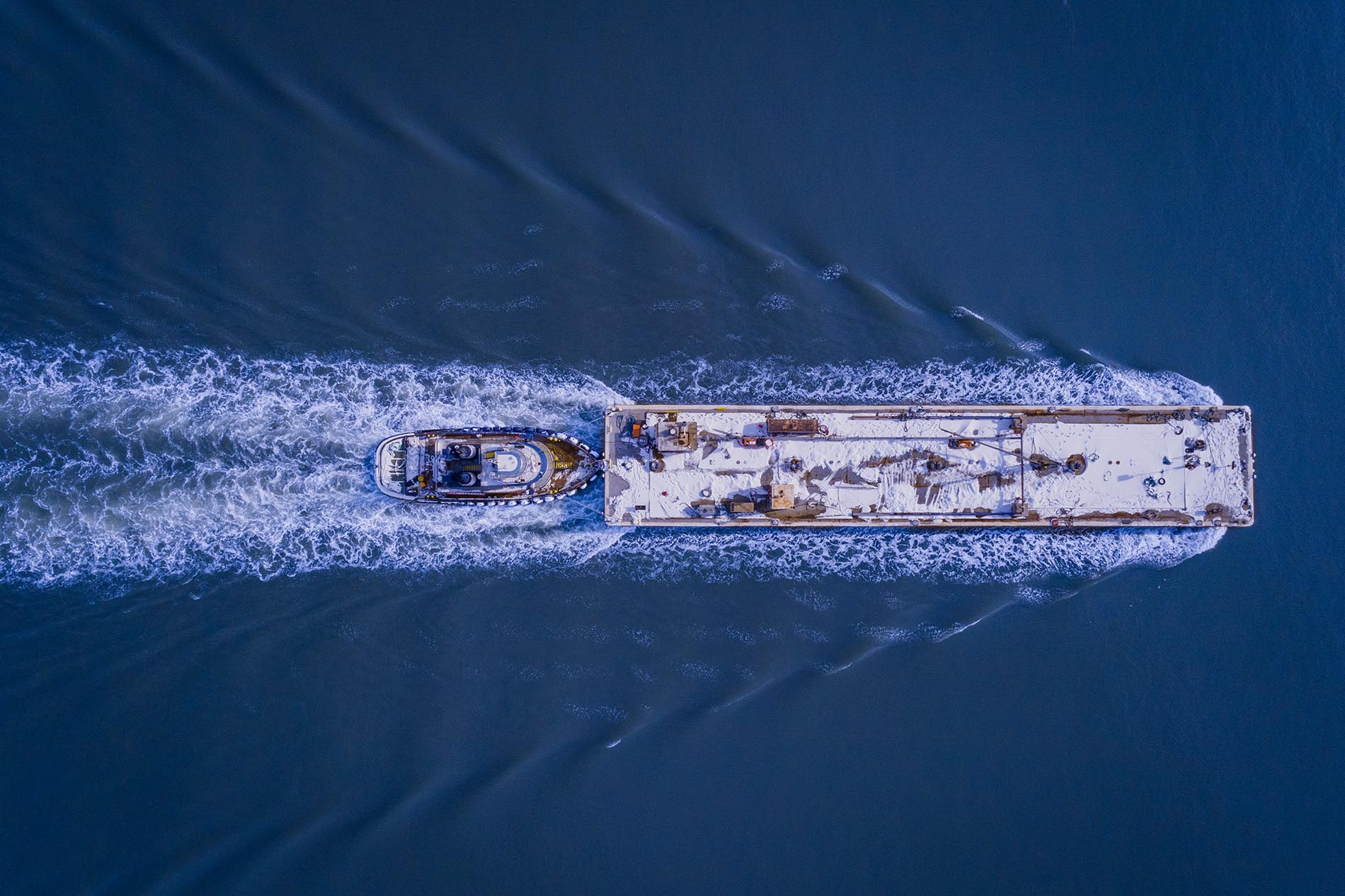 Drone Photograph Nadir angle of a barge going up the Arthur Kill Waterway in New Jersey