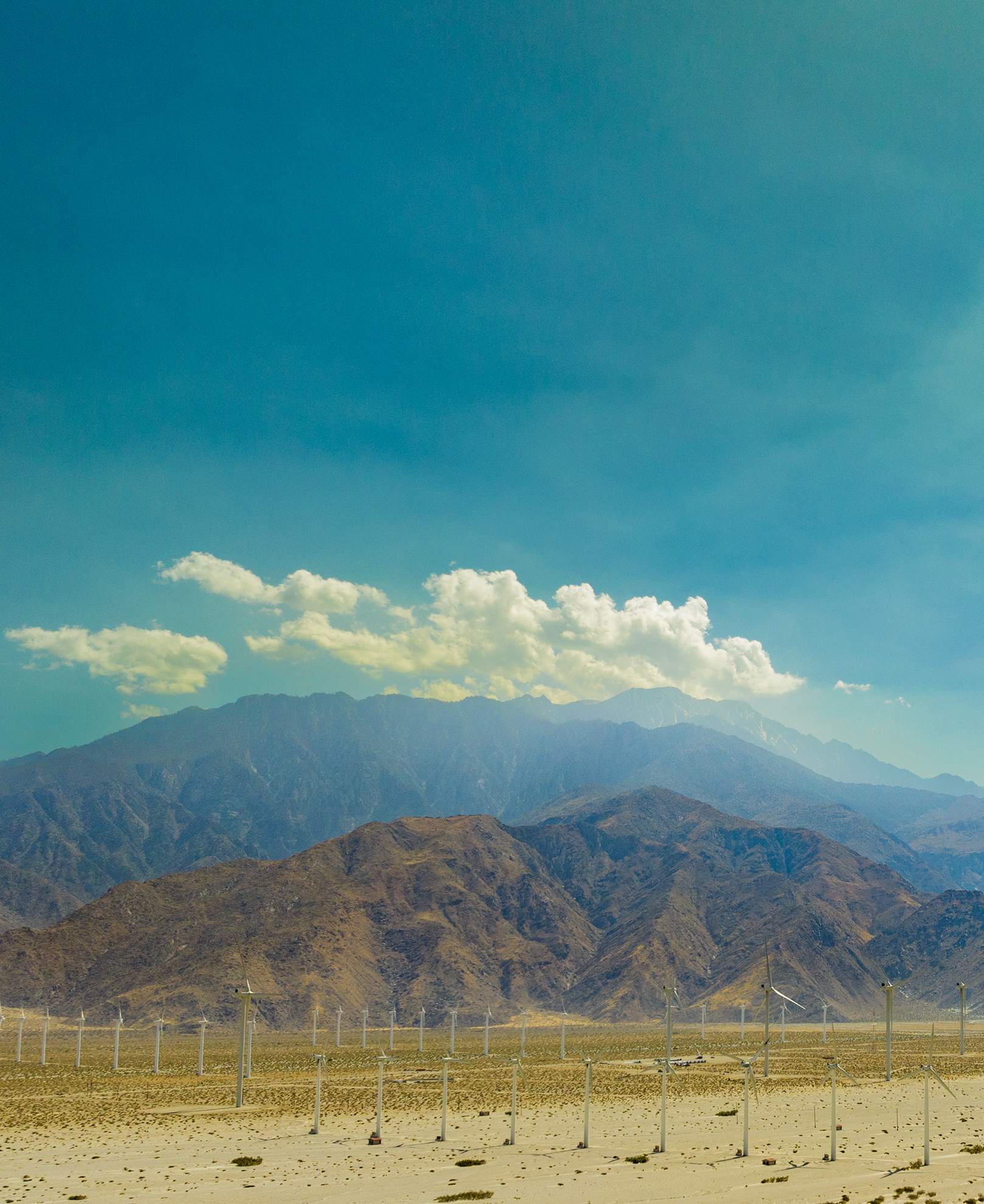 Drone Photograph of wind mills in front of Mt Jacinto, CA