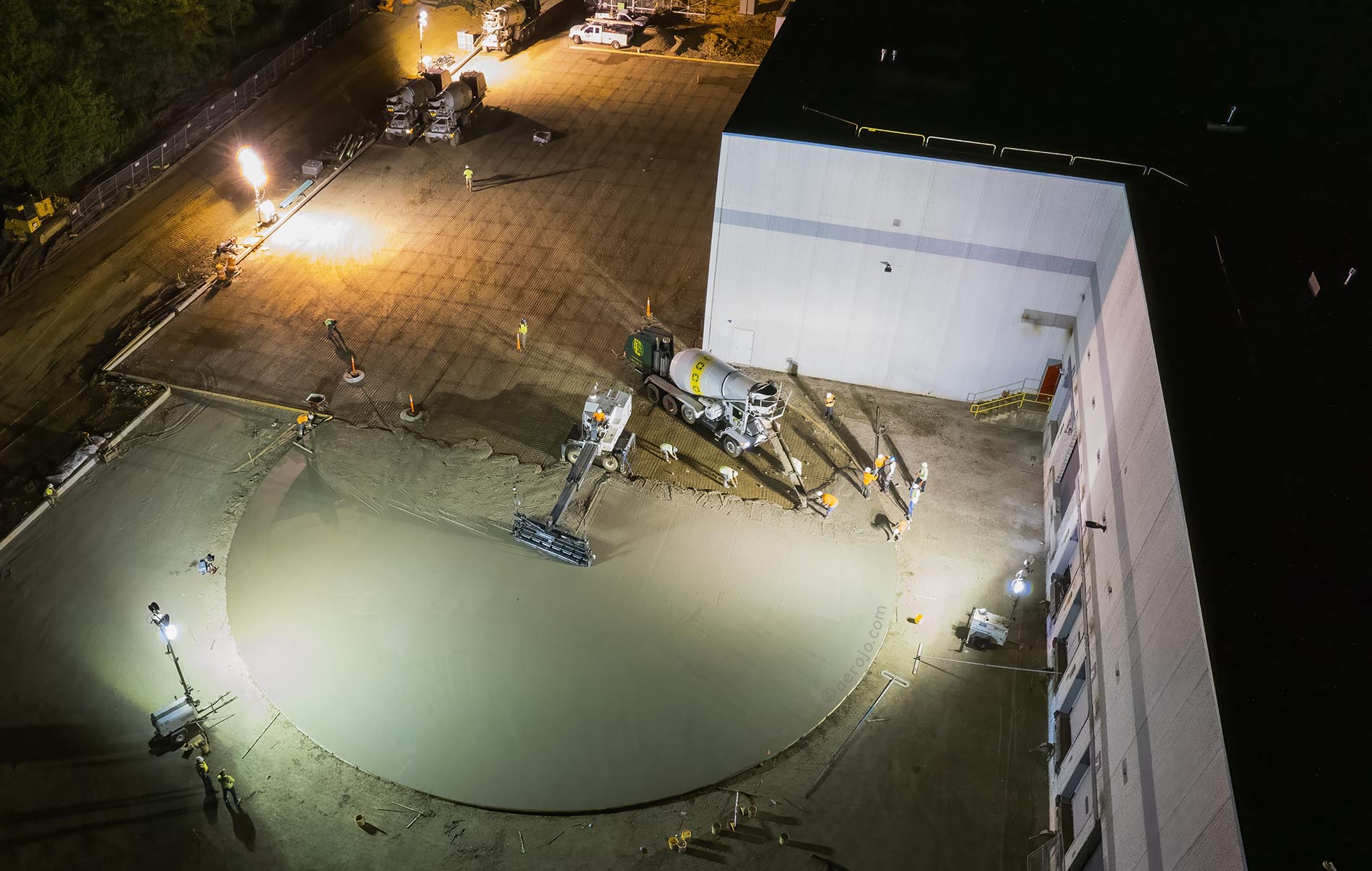 Drone Photograph of birds eye view of concrete pour at night at industrial building in New Jersey
