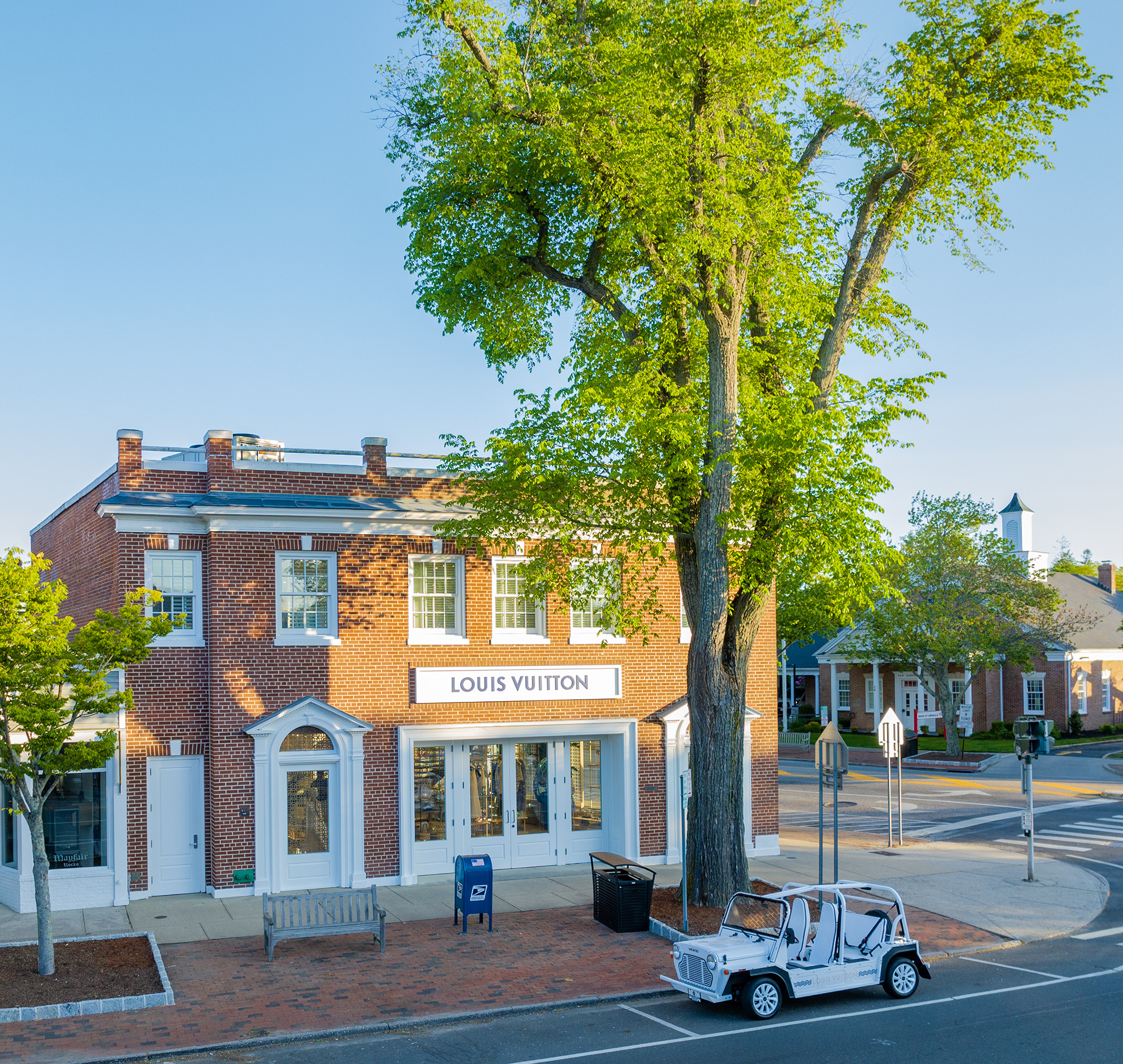 Drone photograph of Louis Vuitton East Hampton, NY Store with a white MOKE at sunrise