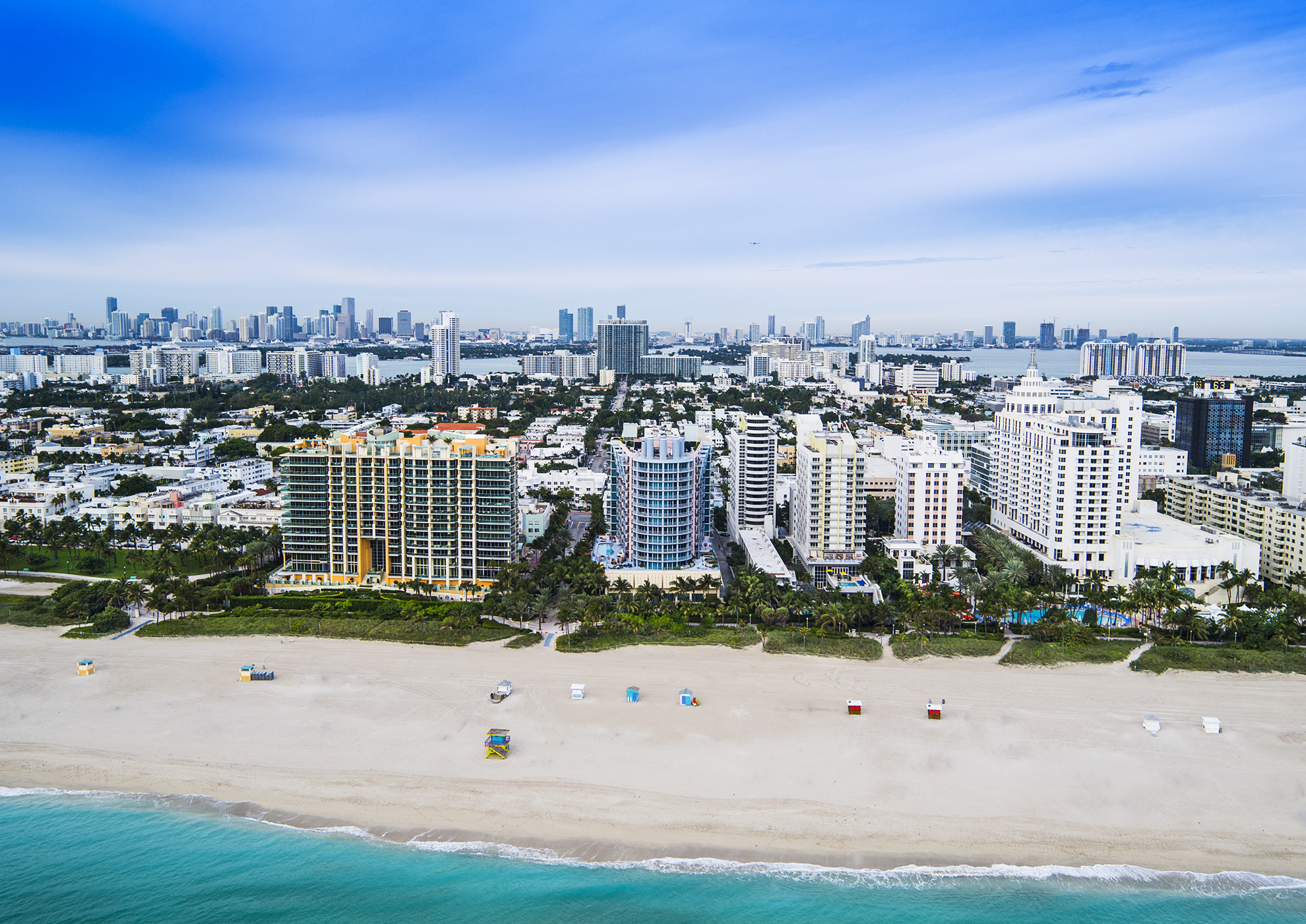 Drone Photograph of Miami Beach from the ocean at sunrise showing the hotels