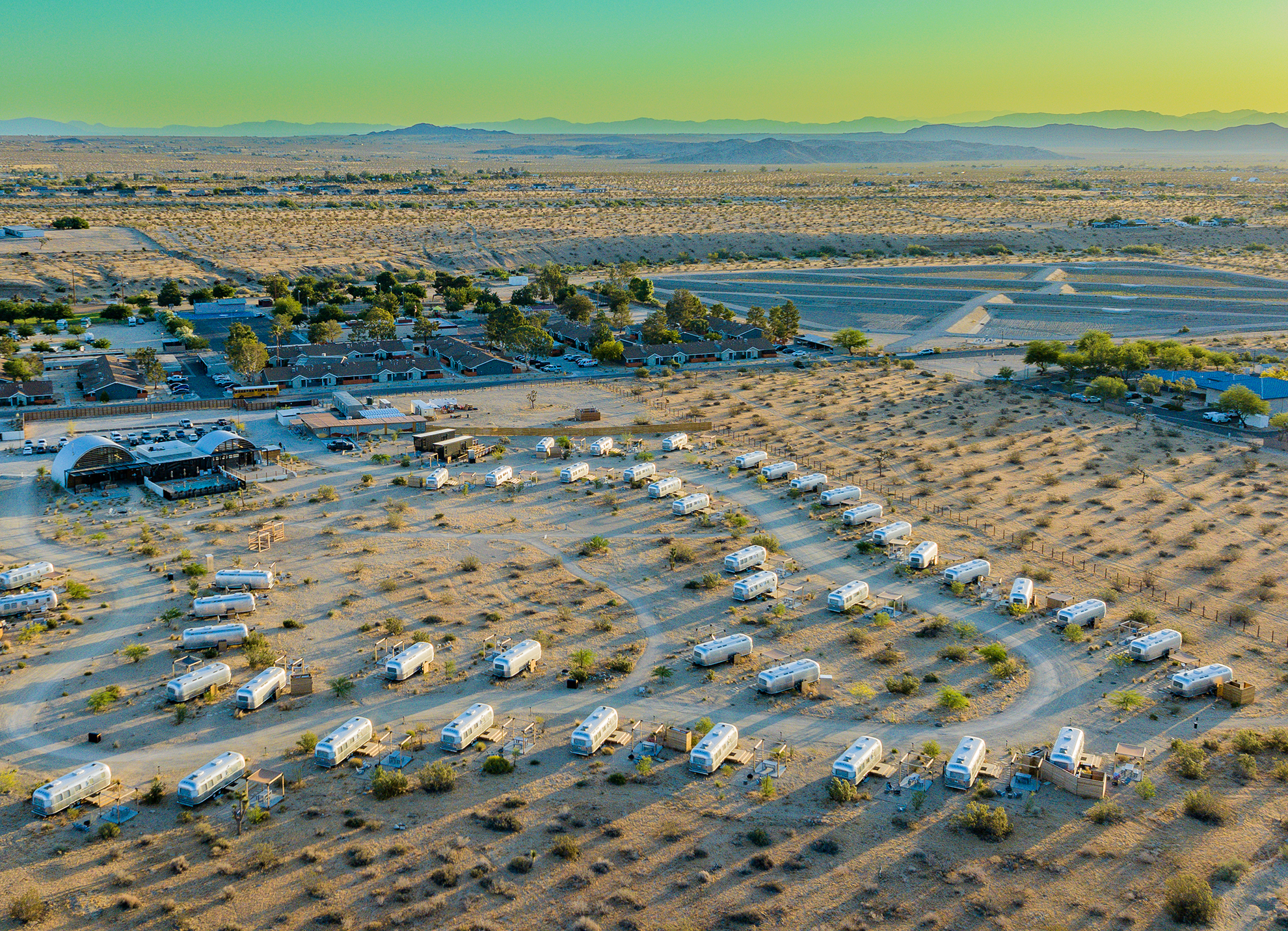 Drone Photograph of Air Stream Camp site with mountains in the background in Joshua Tree, CA
