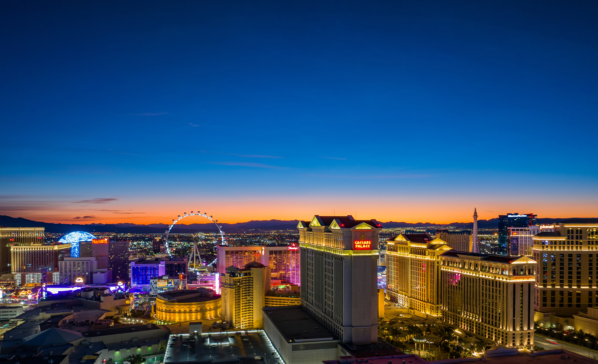 Drone photo at dawn of Las Vegas strip with Caesars palace in foreground