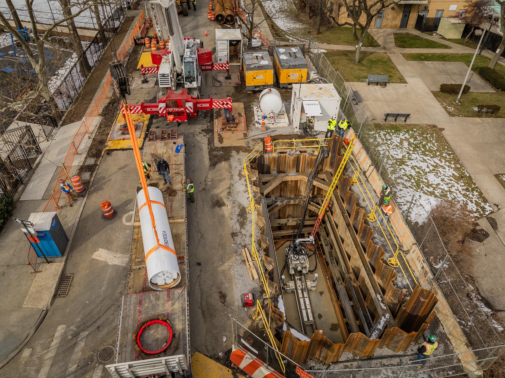 Drone photo of Crane installing Drilling Machine at a Bronx construction site