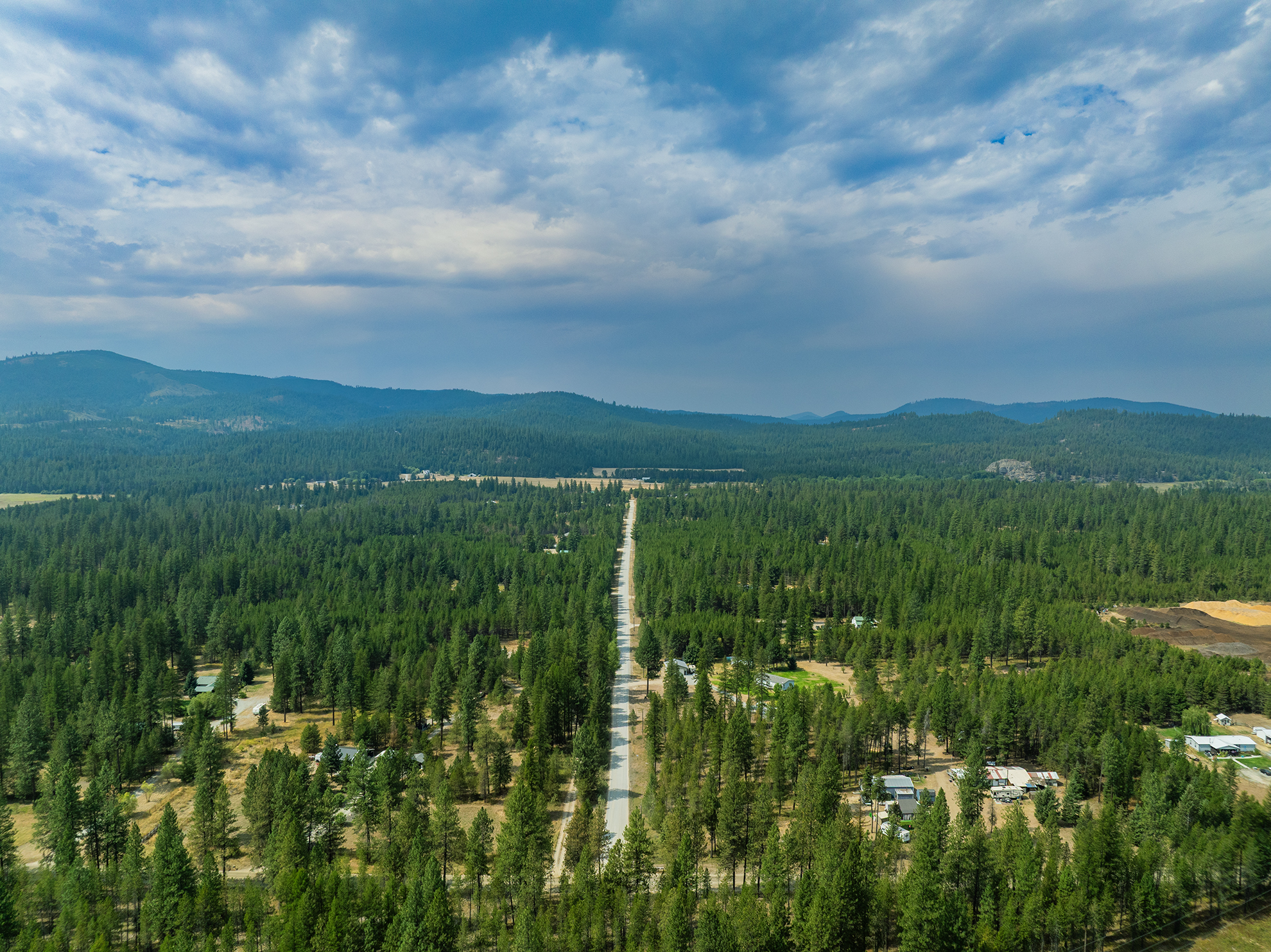 Drone photograph of Redneck Drive Blanchard Idaho with Washington State in the Background